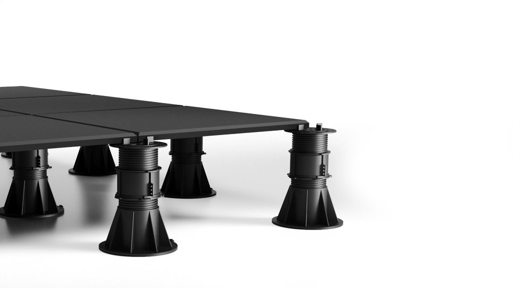 Concrete pavers on adjustable roof deck pedestals