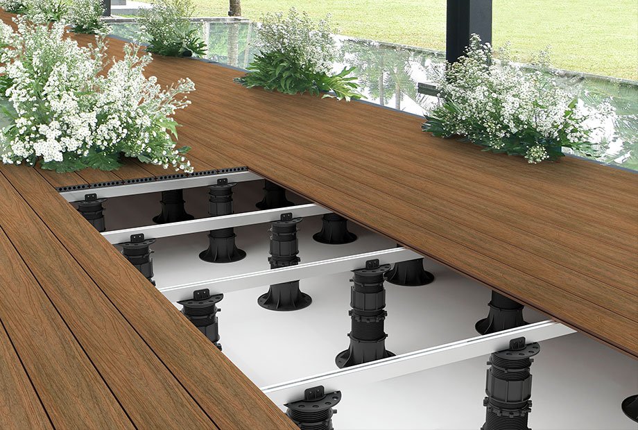 Roof Deck Pedestal System installation showing adjustable pedestals supporting deck planks